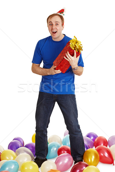Cheerful man with New Year's gift in hands Stock photo © pzaxe