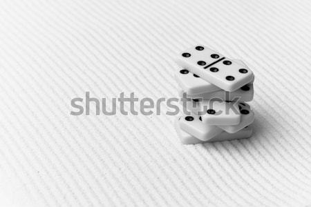 Two dice on yellow sand Stock photo © pzaxe
