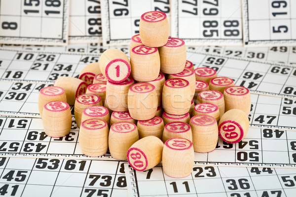 Stock photo: Heap of counters a bingo against game cards