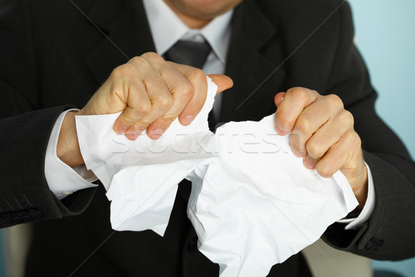 Businessman violently tormented a paper Stock photo © pzaxe