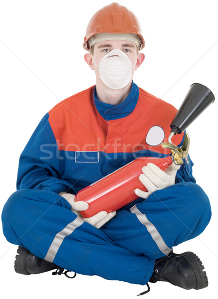 Man in overllas and fire-extinguisher Stock photo © pzaxe