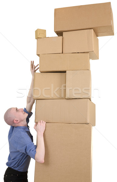 Stock photo: Man trying get the most upper box