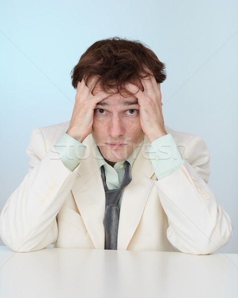 Young businessman sorrowfully recollects yesterday Stock photo © pzaxe