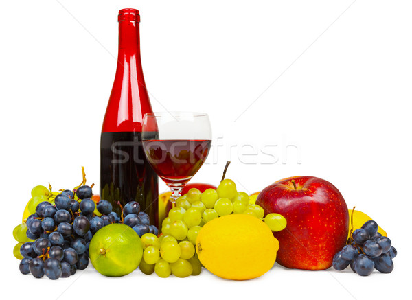 Still life - bottle of red wine and fruits on white background Stock photo © pzaxe
