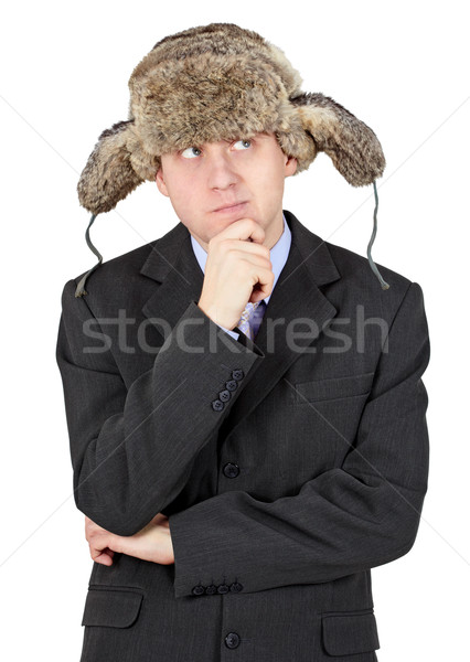 Thoughtful man on white background with a winter hat Stock photo © pzaxe