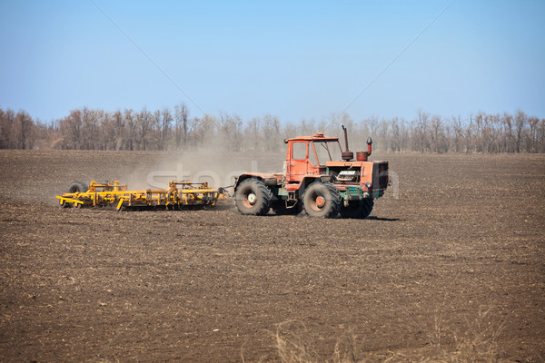 Old agricultural tractor sows Stock photo © pzaxe