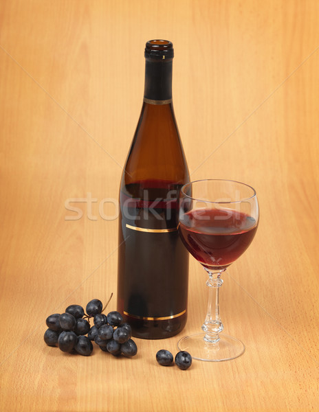 Bottle, glass and grapes on wooden background Stock photo © pzaxe