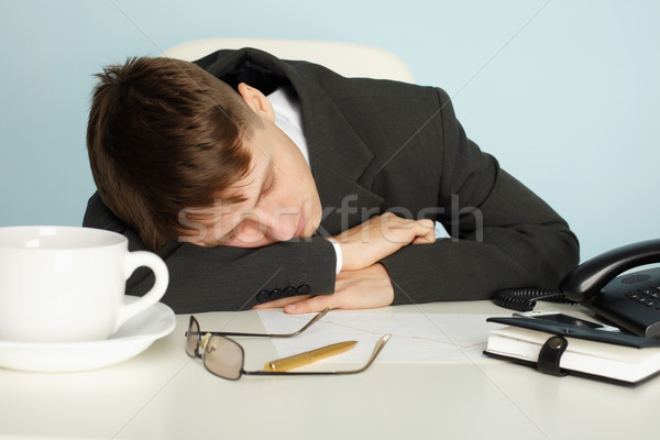Office worker was tired and fell asleep at table Stock photo © pzaxe