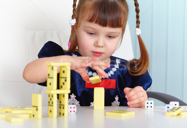 Child playing with dominoes Stock photo © pzaxe