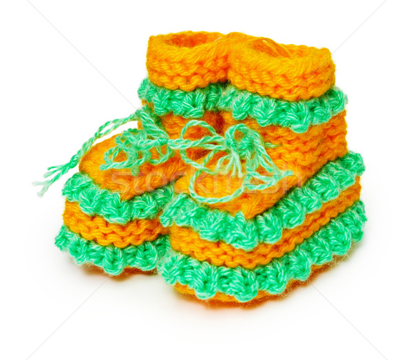 Knitted baby shoes on white Stock photo © pzaxe