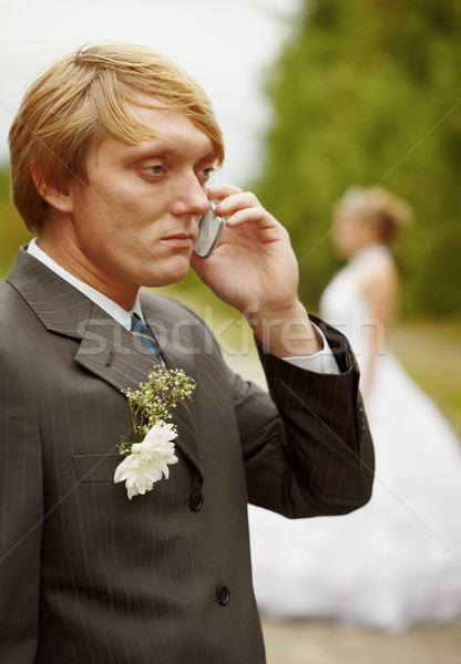 Groom speaks by phone , forgotten about bride Stock photo © pzaxe