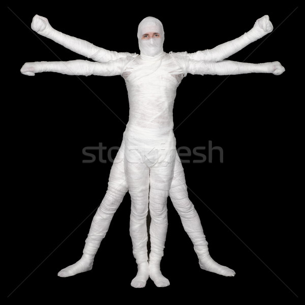 Vitruvian Man - bandaged mummy on black background Stock photo © pzaxe