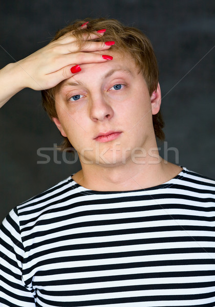 Man with female hand on his forehead Stock photo © pzaxe
