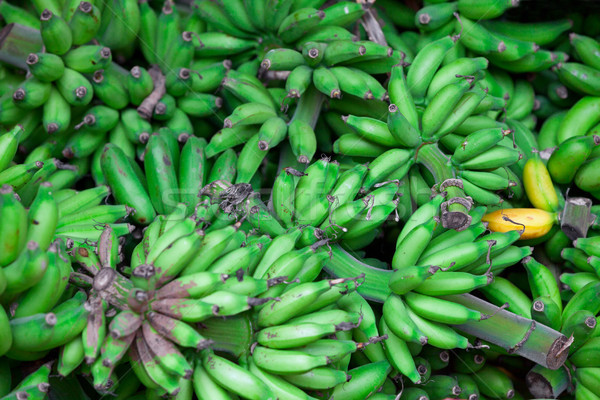 Bunches of green bananas in east market Stock photo © pzaxe