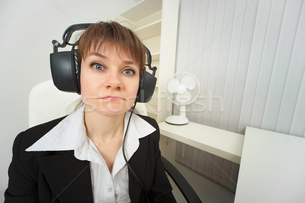 Ridiculous woman dressed on head big ear-phones Stock photo © pzaxe