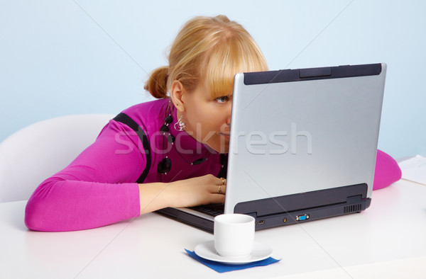 Young girl - is looking closely at laptop monitor Stock photo © pzaxe