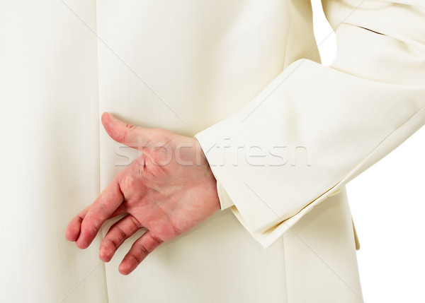 Businessman in white suit with crossed fingers Stock photo © pzaxe