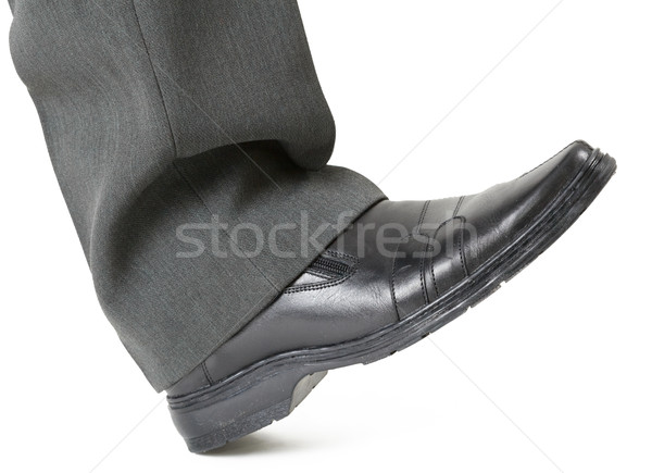 Foot in a shoe ready to crush Stock photo © pzaxe