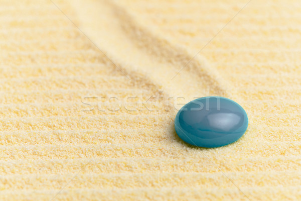 Abstract composition - sandy surface and blue glass drop Stock photo © pzaxe