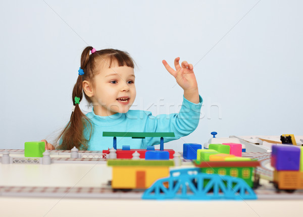Child plays with a toy railroad Stock photo © pzaxe