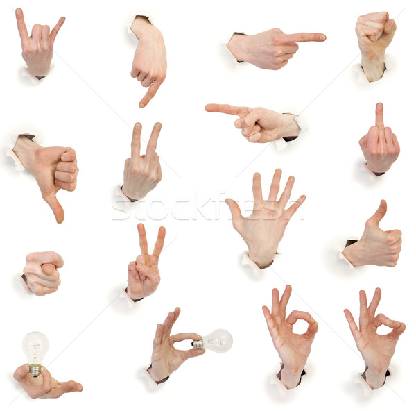 Stock photo: Male hands through white paper