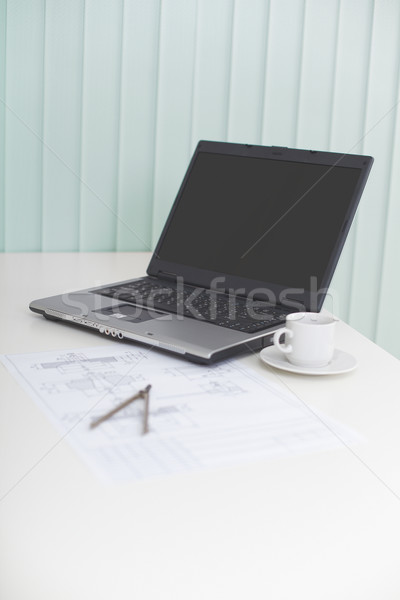 Laptop on table with drawing and a compasses - business still-li Stock photo © pzaxe