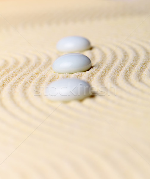 Composition three white stones on yellow sand - Zen Garden Stock photo © pzaxe
