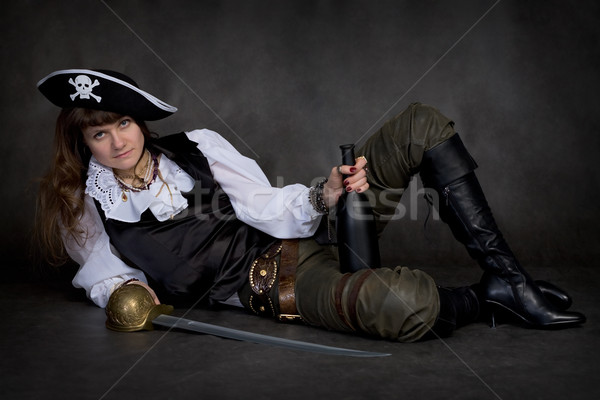 Girl - pirate with rapier and bottle Stock photo © pzaxe