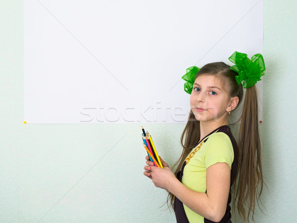 Girl with color pencils and a sheet of paper Stock photo © pzaxe