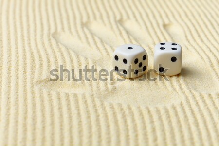 Stock photo: Print of a palm with dices lying on it