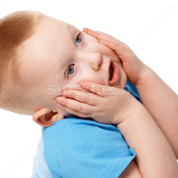 Little boy emotionally grabbed hold of face Stock photo © pzaxe