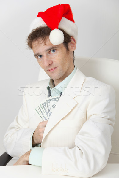 Person hides Christmas prize in pocket Stock photo © pzaxe