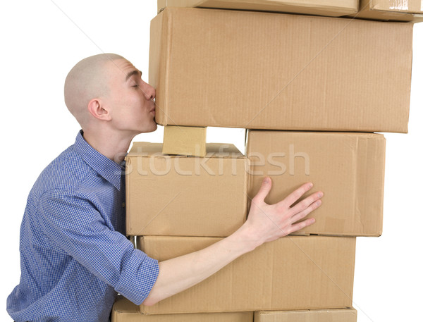 Man kisses heap cardboard boxes Stock photo © pzaxe