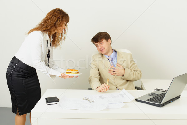 Young woman delivered to chief a sandwich to dinner Stock photo © pzaxe