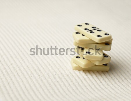 Two white dice with black dots on sand Stock photo © pzaxe