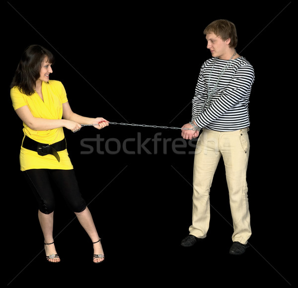 Young girl conducts on a chain of the guy Stock photo © pzaxe