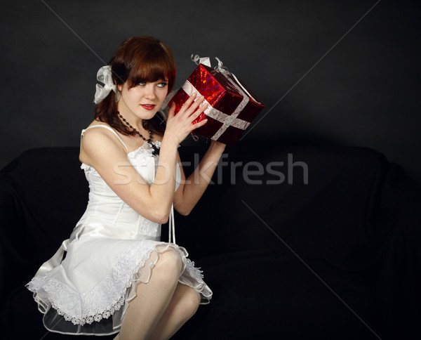 Happy young girl has received a gift Stock photo © pzaxe