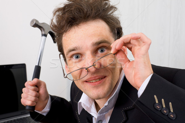 Insane uomo martello mano imprenditore occhiali Foto d'archivio © pzaxe