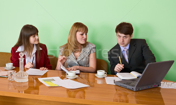 Business team sits at the table Stock photo © pzaxe