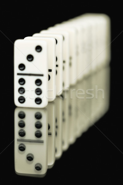 Bones of dominoes on a black background Stock photo © pzaxe