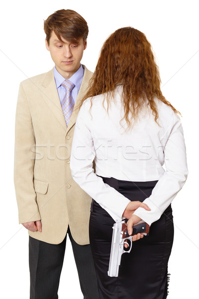 Young man and the woman armed with a pistol Stock photo © pzaxe