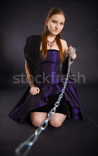 Young beautiful girl pulls out a chain leash Stock photo © pzaxe