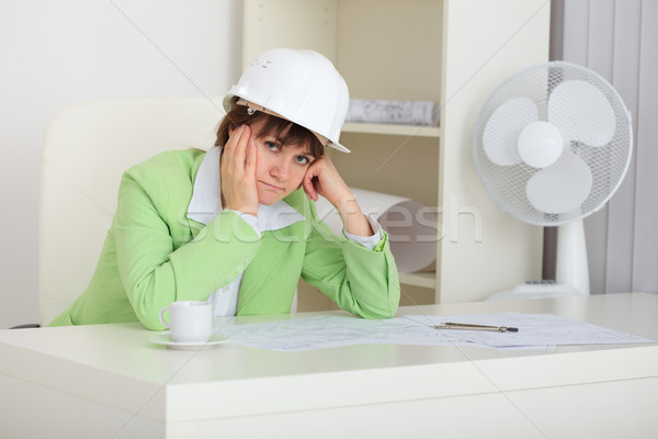 Thoughtful woman - builder in helmet Stock photo © pzaxe