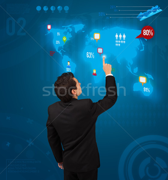 Businessman pressing social media button on digital map Stock photo © ra2studio