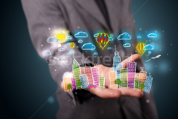 Young businessman presenting colorful hand drawn metropolitan ci Stock photo © ra2studio