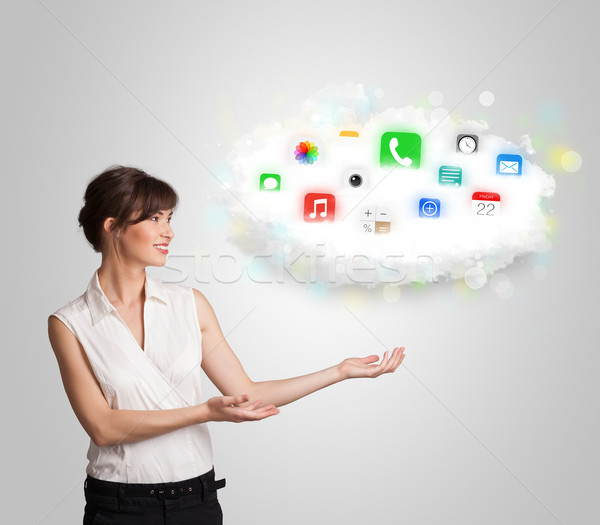 Young woman presenting cloud with colorful app icons and symbols Stock photo © ra2studio