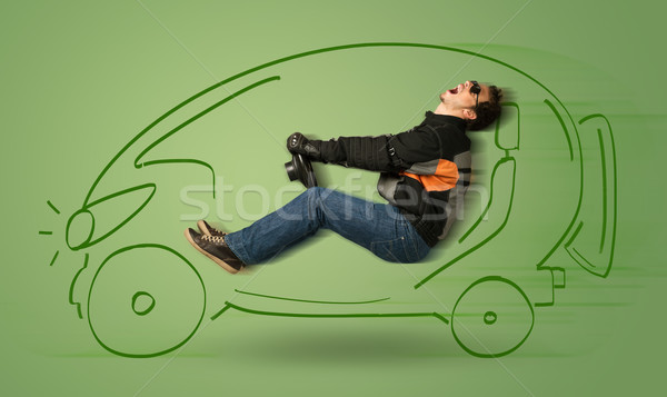 Man drives an eco friendy electric hand drawn car  Stock photo © ra2studio