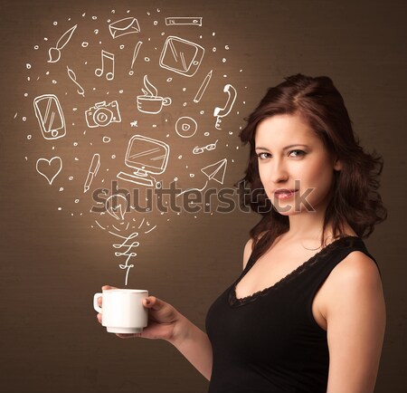 Businesswoman holding a white cup with social media icons Stock photo © ra2studio