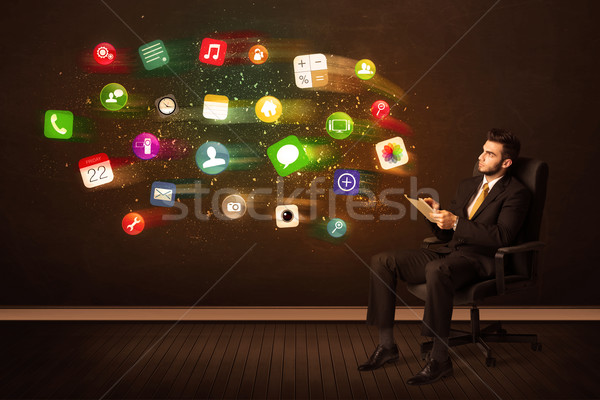 Homem de negócios sessão cadeira de escritório comprimido colorido aplicativo Foto stock © ra2studio