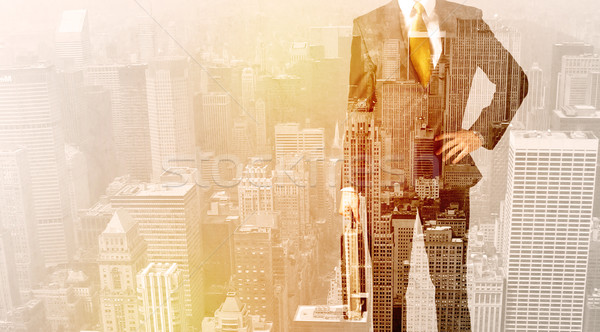 Business man looking at overlay city background Stock photo © ra2studio